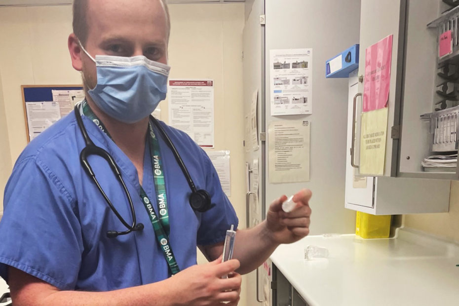 Dr Aodhan Foster, standing in a doctor's room