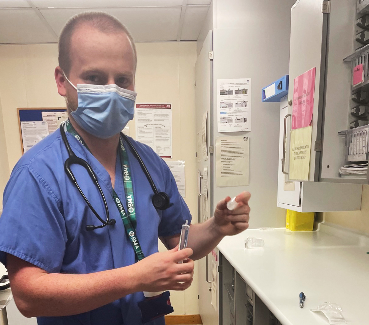 Dr Aodhan Foster, standing in a doctor's room