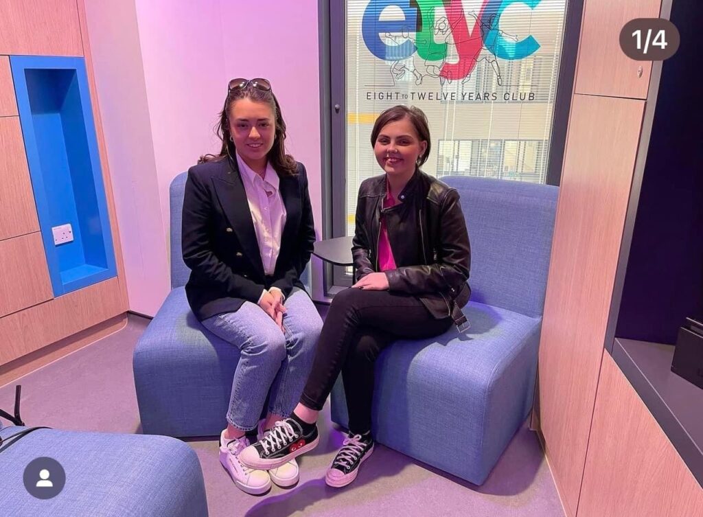 Sara Millar and Molly Cuddihy sitting in the Schiehallion Ward at the Royal Hospital for Children