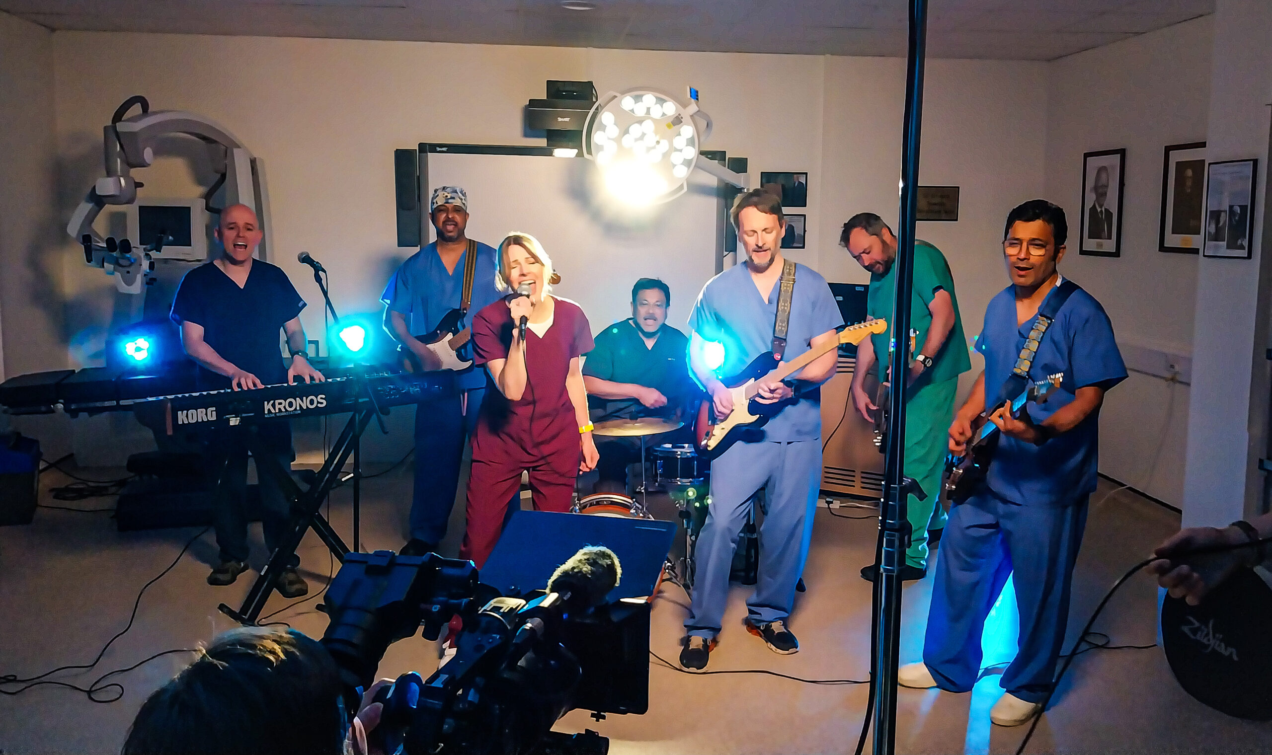 A band in NHS staff uniforms are filmed performing the song for the video.