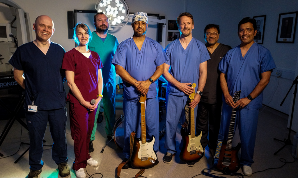 The Nutcrackers band, dressed in NHS uniforms, during filming at the INS.