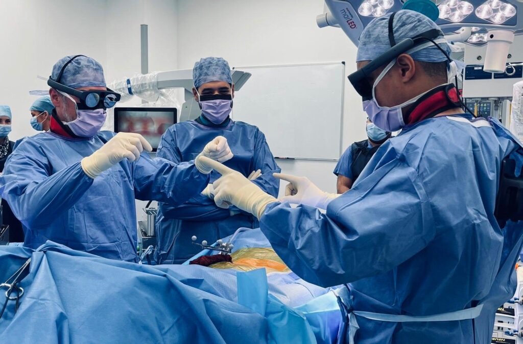 INS surgeons in theatre, wearing the new Mixed Reality equipment.