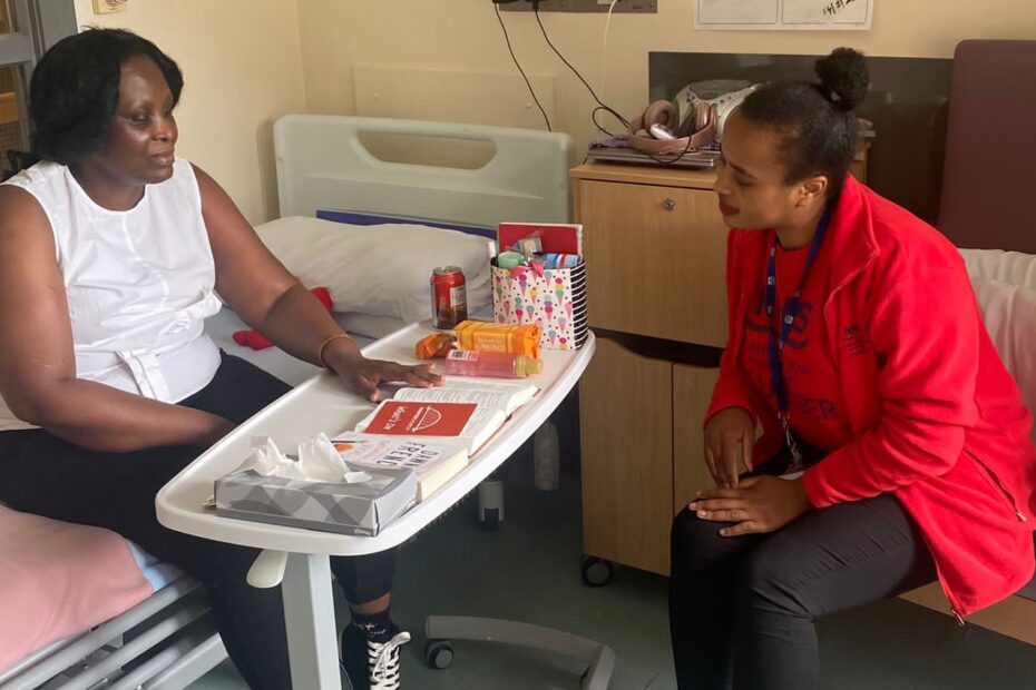 Nothuba with a patient as part of her volunteering.