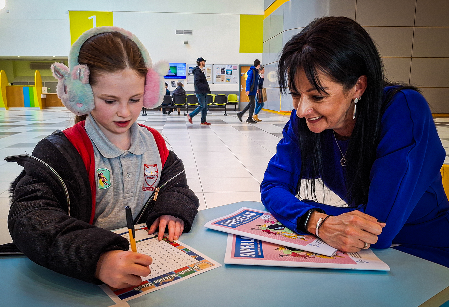 Professor Catherine Ross with young visitor Rose Moan, 7